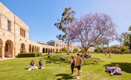 Students walking on the grass in the Great Court