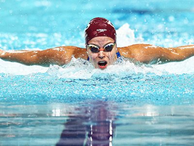 An elite swimmer racing in a pool