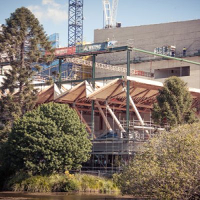 The Advanced Engineering Building roof is lifted into place.