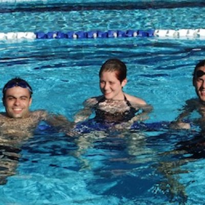 UQ students, from left, Diogo Costa, Erin Duddy and Boyd Watson enjoy the new pool.