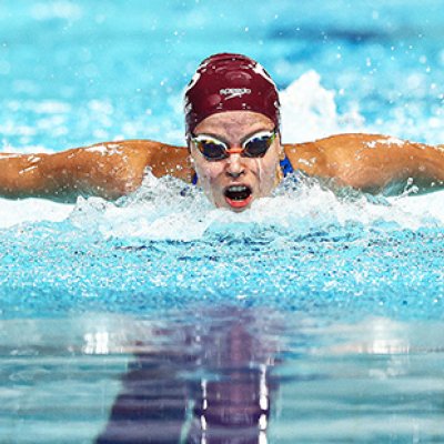 An elite swimmer racing in a pool