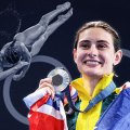 Maddison Keeney holding a silver Olympic medal and smiling with an Australian flag around her shoulders