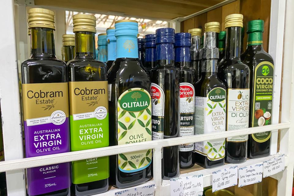 Bottles of olive oil on a shelf