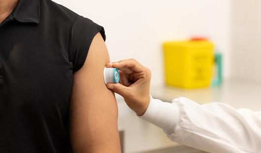 The Vaxxas high-density microarray patch technology being administered via an easy-to-use applicator.