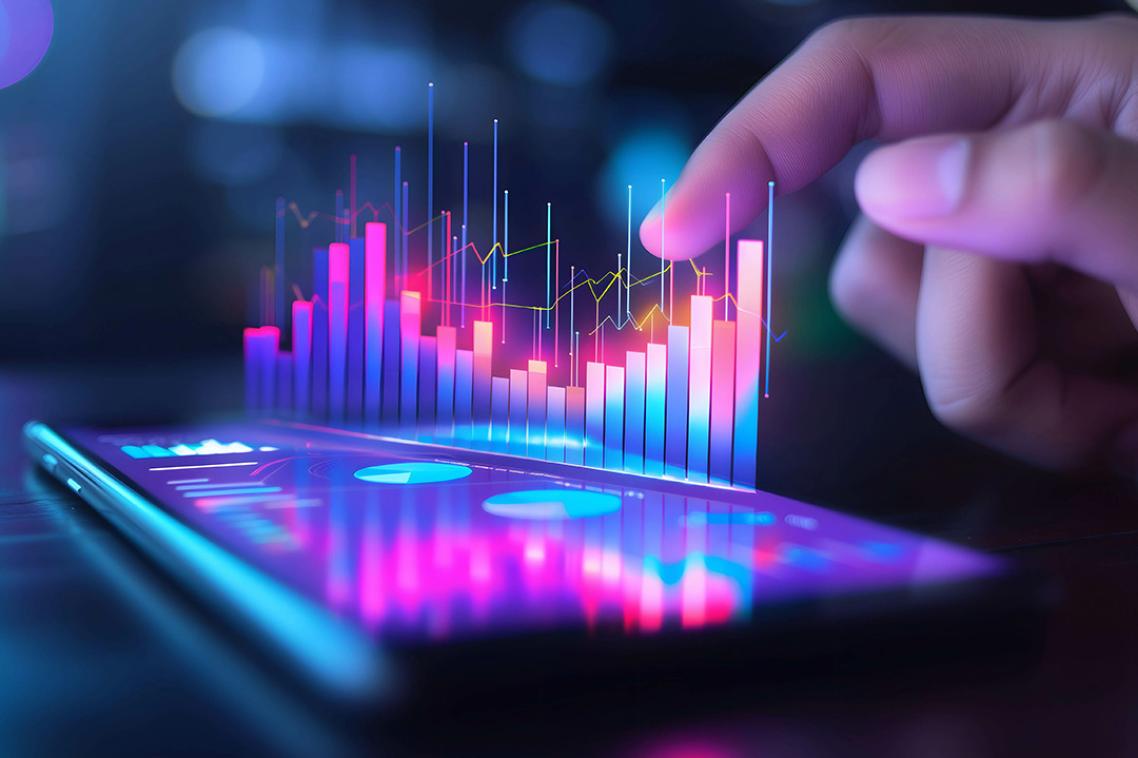 A graphic showing cryptocurrency stock charts coming out of a lit-up mobile phone screen as a finger hovers above it. 