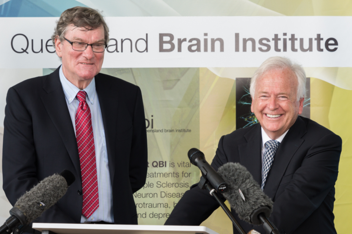 Two men standing in front of a lecturn