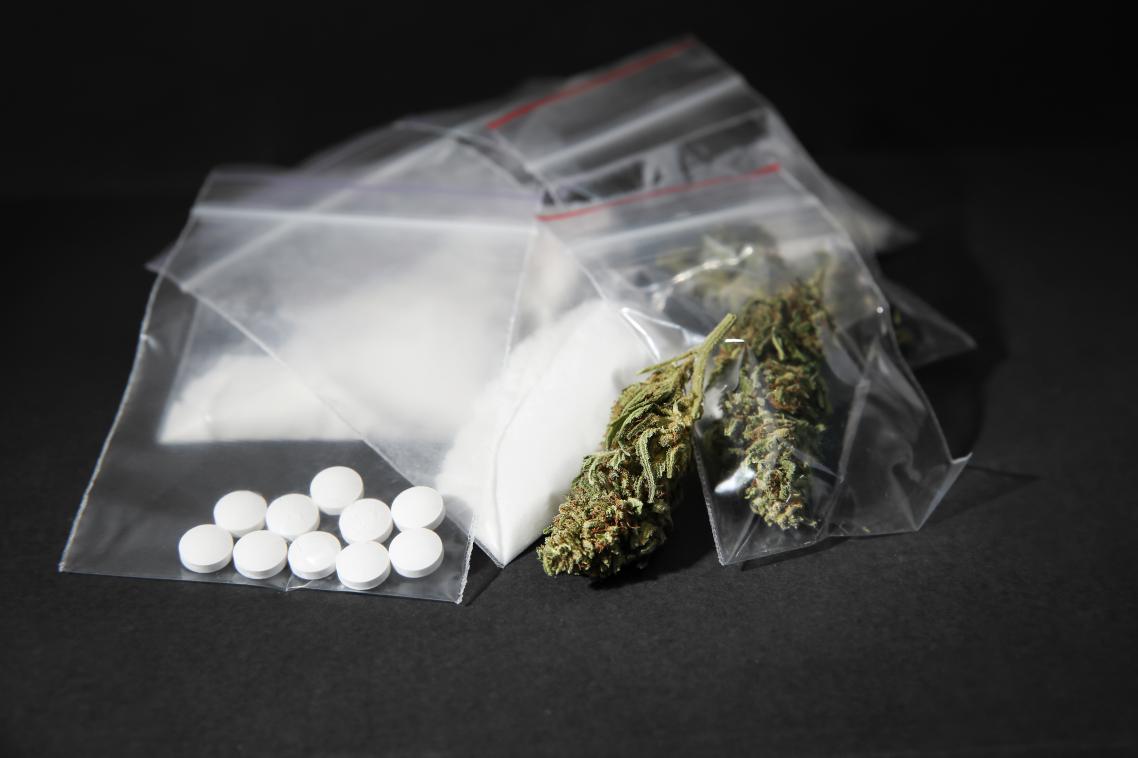 Plastic bags filled with white pills and other drugs.
