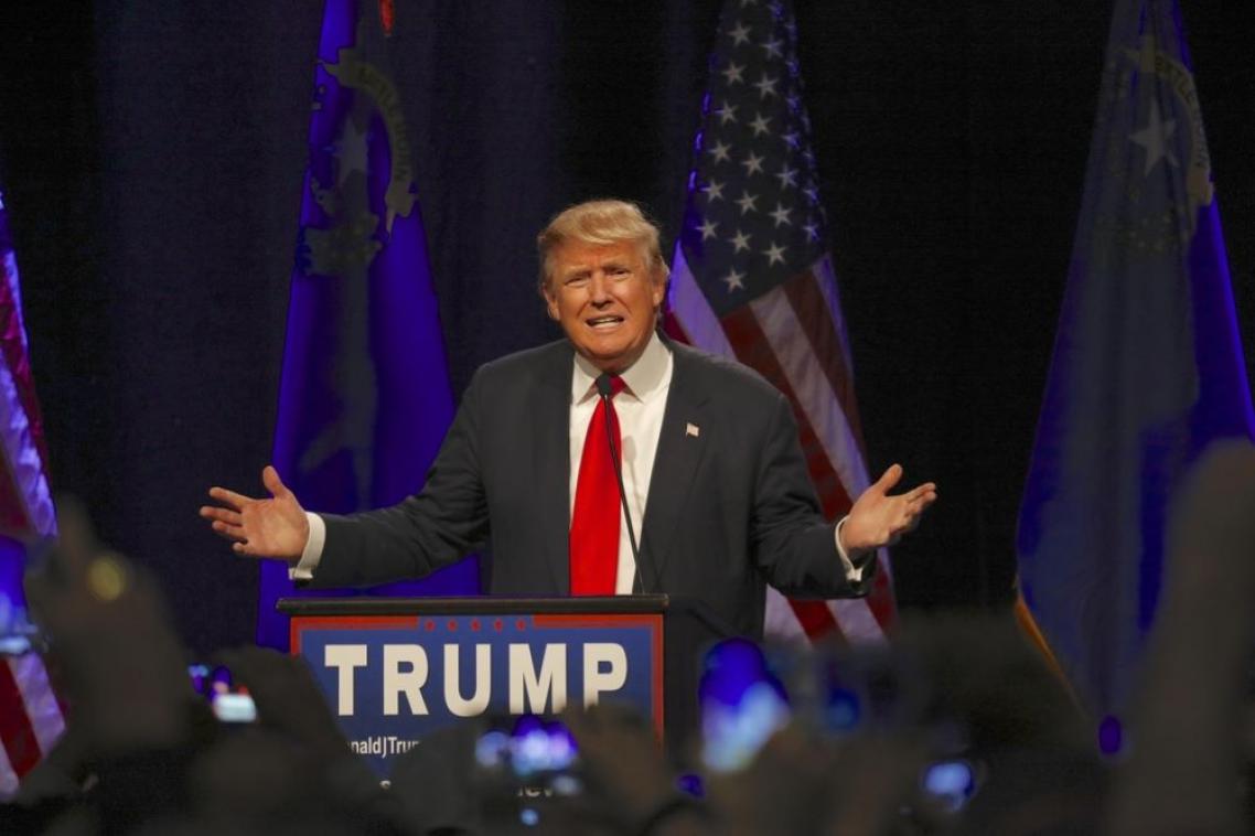 Trump addressing a large crowd.