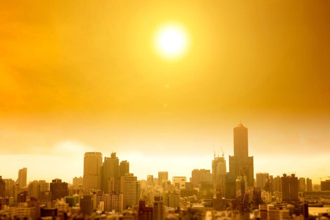 Sun setting over city skyline. Adobe