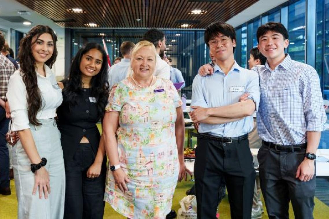 Professor Riitta Partanen standing with with 4 first-year regional medical students.