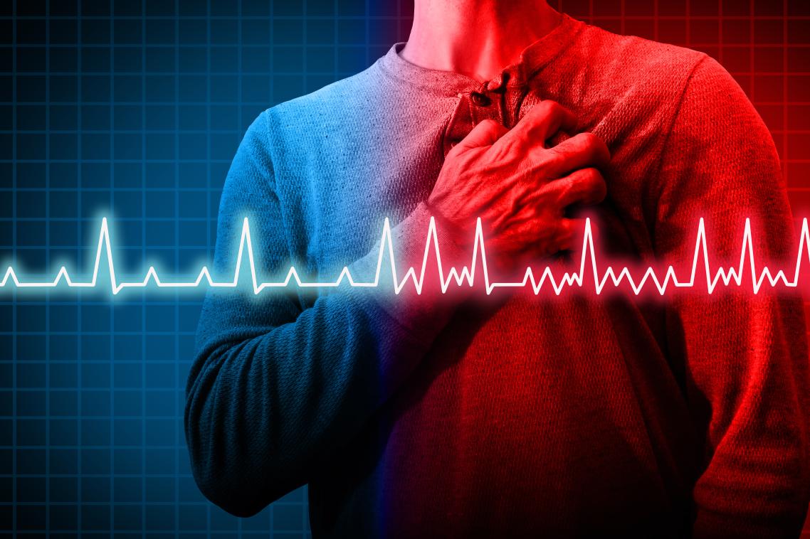 A man grabbing his heart.