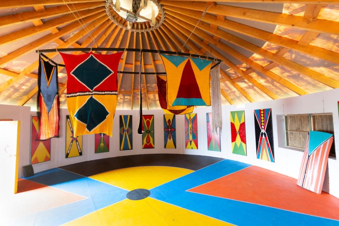 The interior of a colourful hut