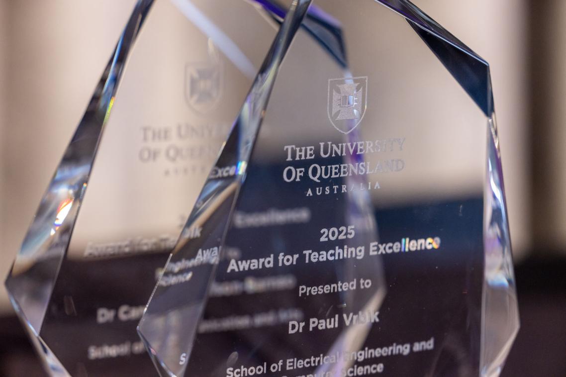 A closeup of a glass trophy commending Dr Paul Vrbik for his 2025 Teaching and Learning Week award