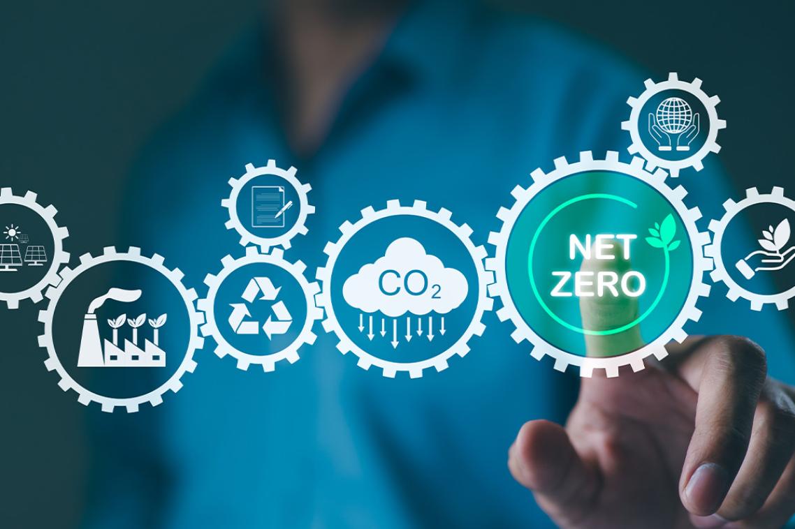 A graphic showing graphics about climate in mid air as a finger points toward one that says net zero.