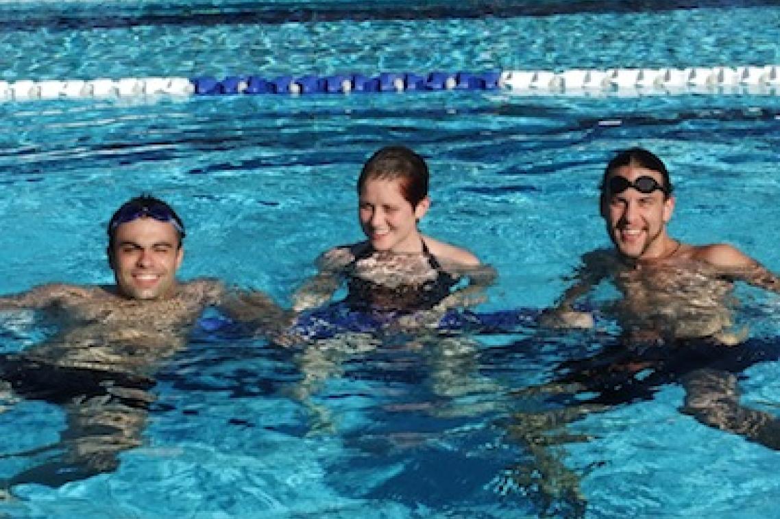 UQ students, from left, Diogo Costa, Erin Duddy and Boyd Watson enjoy the new pool.