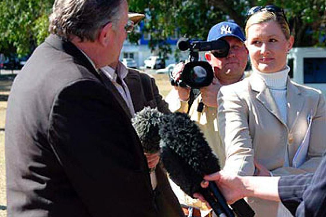 Bruce Redman (centre) films Family First candidate John Lewis during the 2004 Federal Election campaign