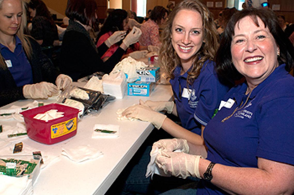 Midwifery student Kimberley Retschleg and Bachelor of Midwifery and Dual Degree Coordinator Susannah Brady prepare birthing kits
