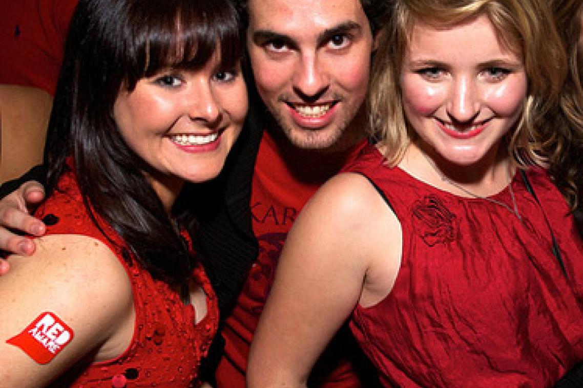 From left, Claire Mohr, Steve Ashburn and Tara Malcom dress in red for last year's TIME Red Party.