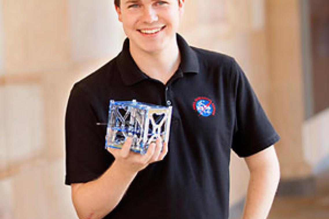 Michael Kehoe, UQ final year student of the School of Information Technology and Electrical Engineering. Pictured with his final year thesis project, a satellite that uses Android mobile phone technology as its on-board computer. Michael has recently completed a five week-internship with NASA. He has built a phonesat that will be launched by NASA into space on November 25.