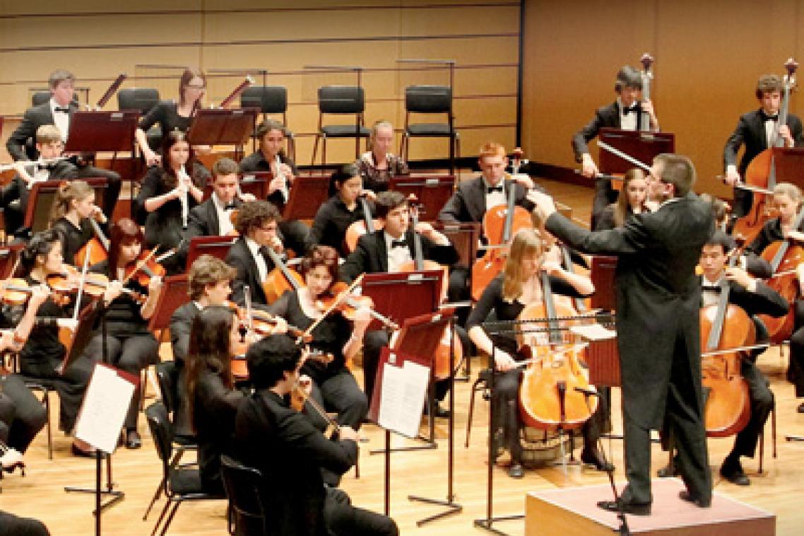 UQ Symphony Orchestra with conductor, Warwick Potter.