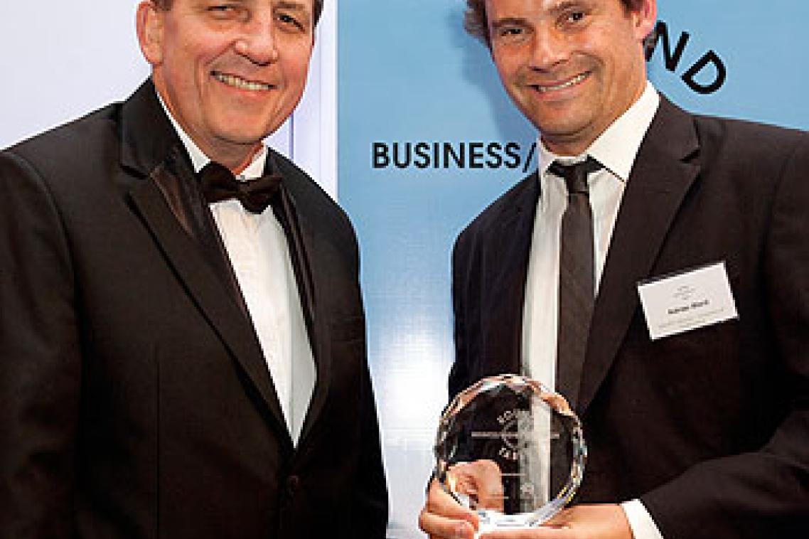 Senator Chris Evans presents Adrian Ward with the Outstanding Excellence in Collaboration award