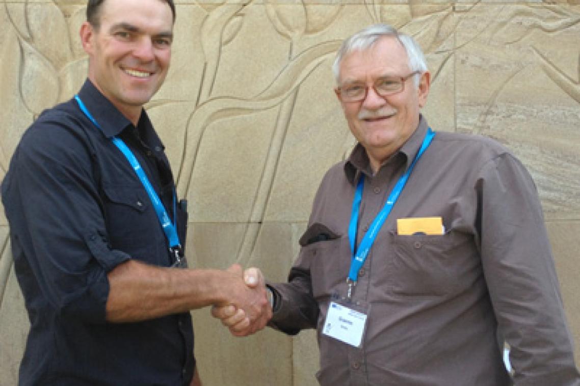 UQ Diploma of Agriculture Graduate Paul Roderick with trainer Graeme Busby.