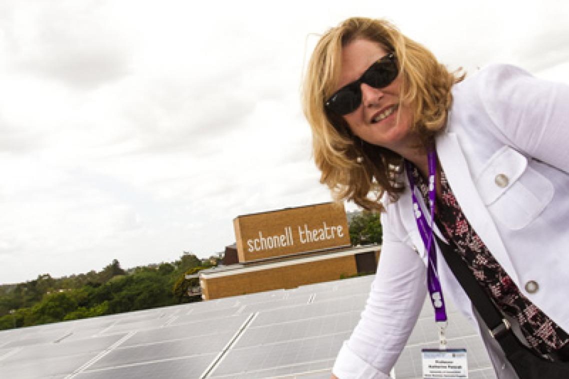 Professor Katherine Pancak from the University of Connecticut checks out UQ's 1.22 megawatt photovoltaic solar array, which generates electricity for the St Lucia campus in Brisbane.