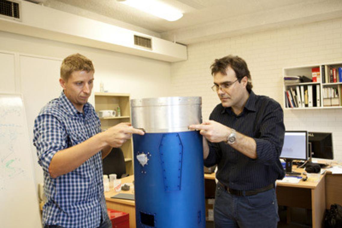 In the early stages of the scramjet's assembly, Dr Sandy Tirtey of UQ and Dr Roberto Gardi of Italian Aerospace Research Centre (CIRA) attach winglets made of a ceramic material which will be tested on its flight in Norway this year.
