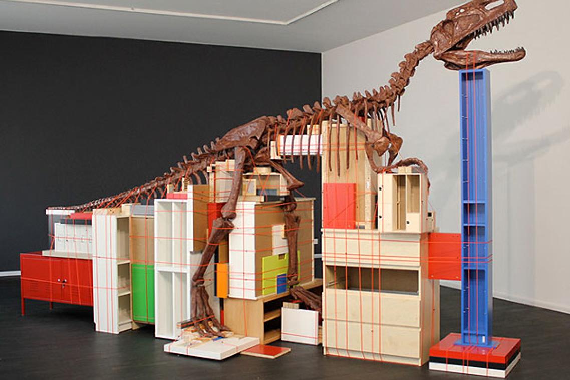 Claire Healy and Sean Cordeiro, ‘Future Remnant’ 2011, dinosaur fossil replica, IKEA furnishings, cable binding, 285 x 180 x 485 cm irreg. 
Courtesy of the artists and Nature Morte, Berlin and Gallery Barry Keldoulis, Sydney and © the artists