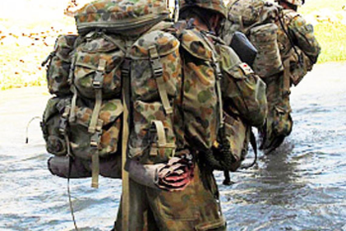 Mentoring and Reconstruction Task Force 2 soldiers cross one of many rivers whilst on patrol through Sorkh Lez in the Mirabad Valley, Southern Afghanistan. Photo by Corporal Rachel Ingram