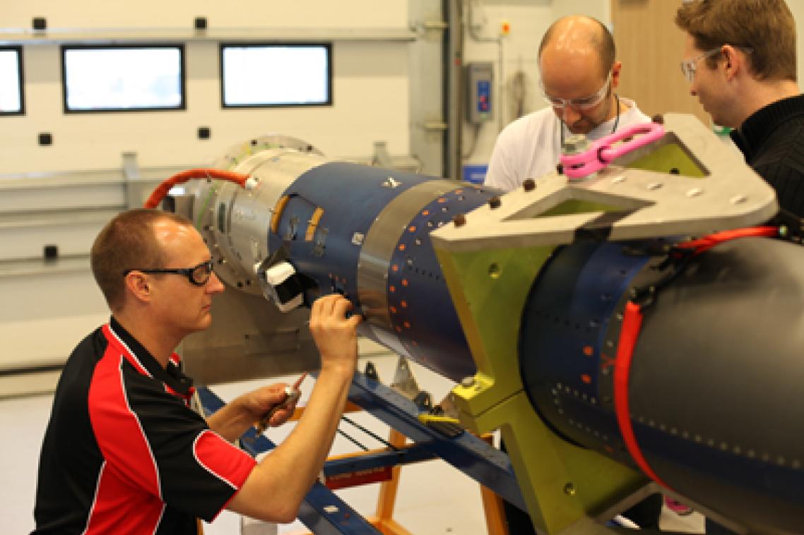 Brad Sharp, Dr Melrose Brown and Dr Michael Creagh from the SCRAMSPACE team work to finalise the payload for the upcoming launch. Credit: Donald Cook.
