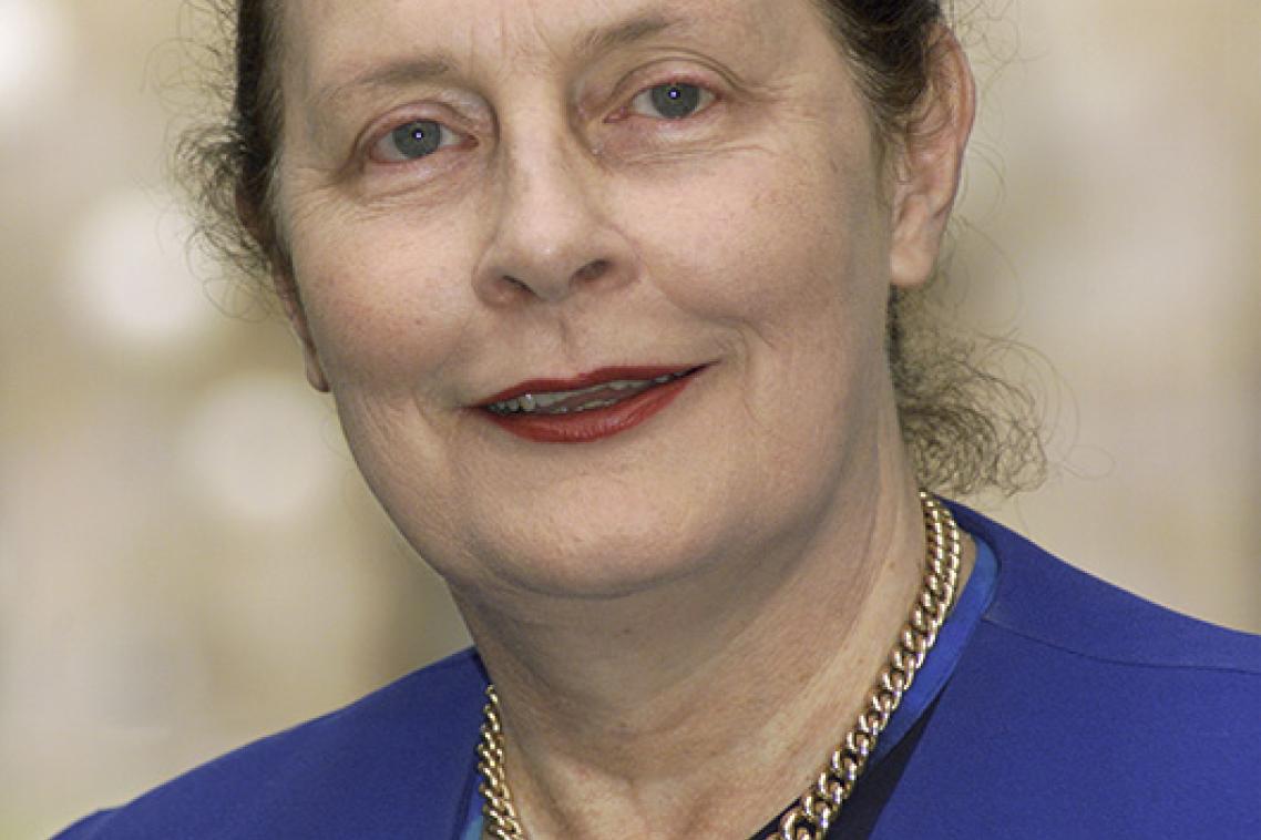 Head shot of a woman in a blue jacket