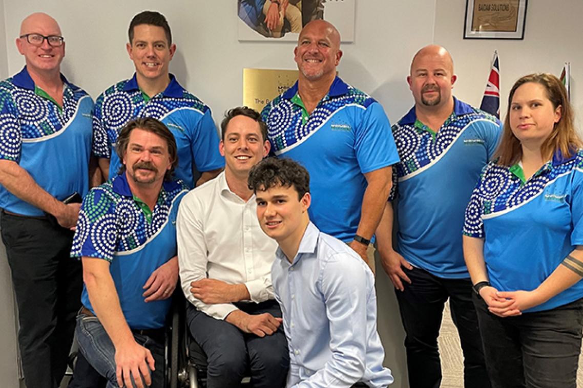 Denzel Strauss (foreground) at his scholarship presentation with Baidam Solutions staff including CEO Phillip (Pip) Jenkinson (kneeling in second row)