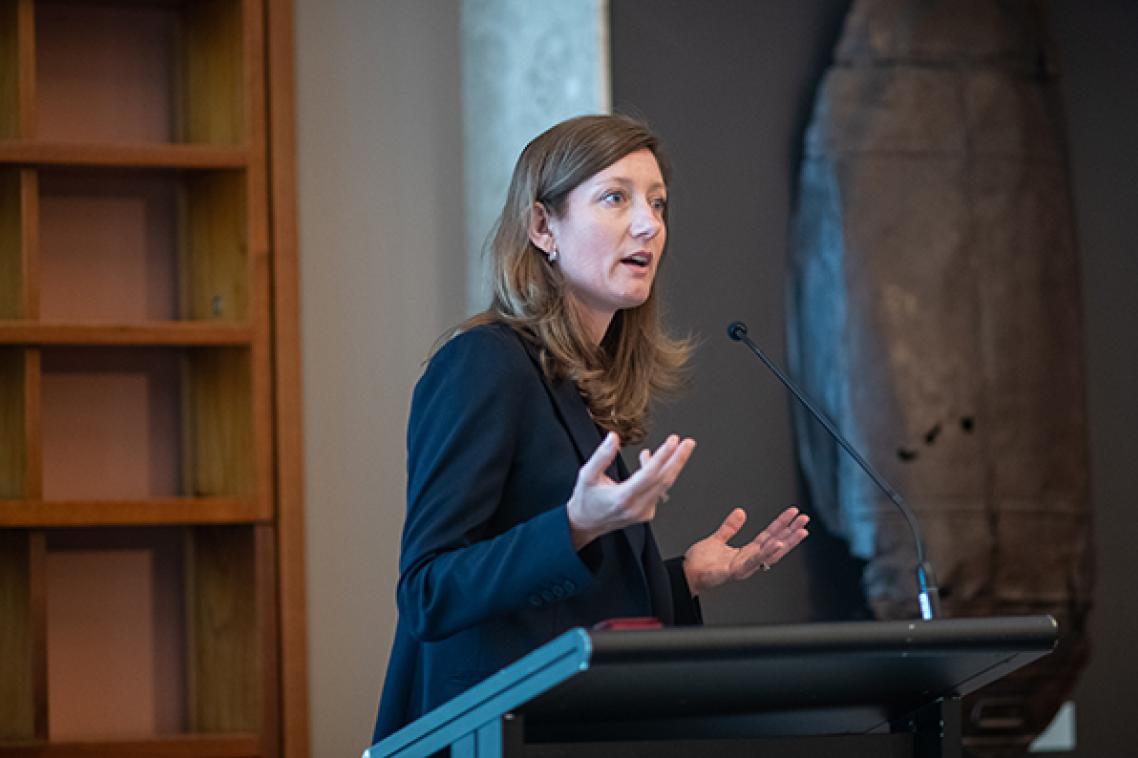Professor Nicole Gillespie speaking at a podium