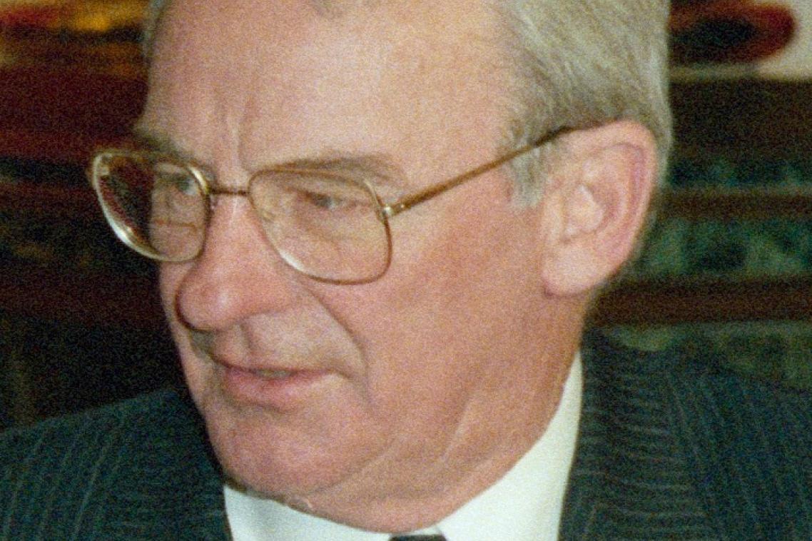 Man in suit wearing glasses