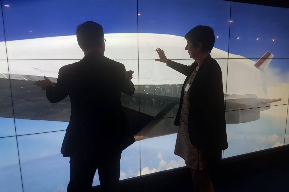 Dignitaries learn more about joint UQ-Boeing initiatives via a massive digital touch screen.