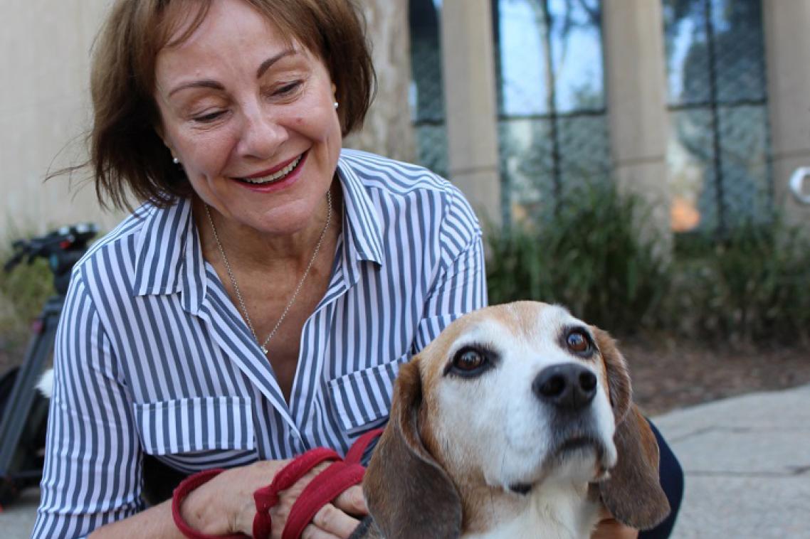Owner-Brenda-Douglas-pats-her-beagle-Hoover