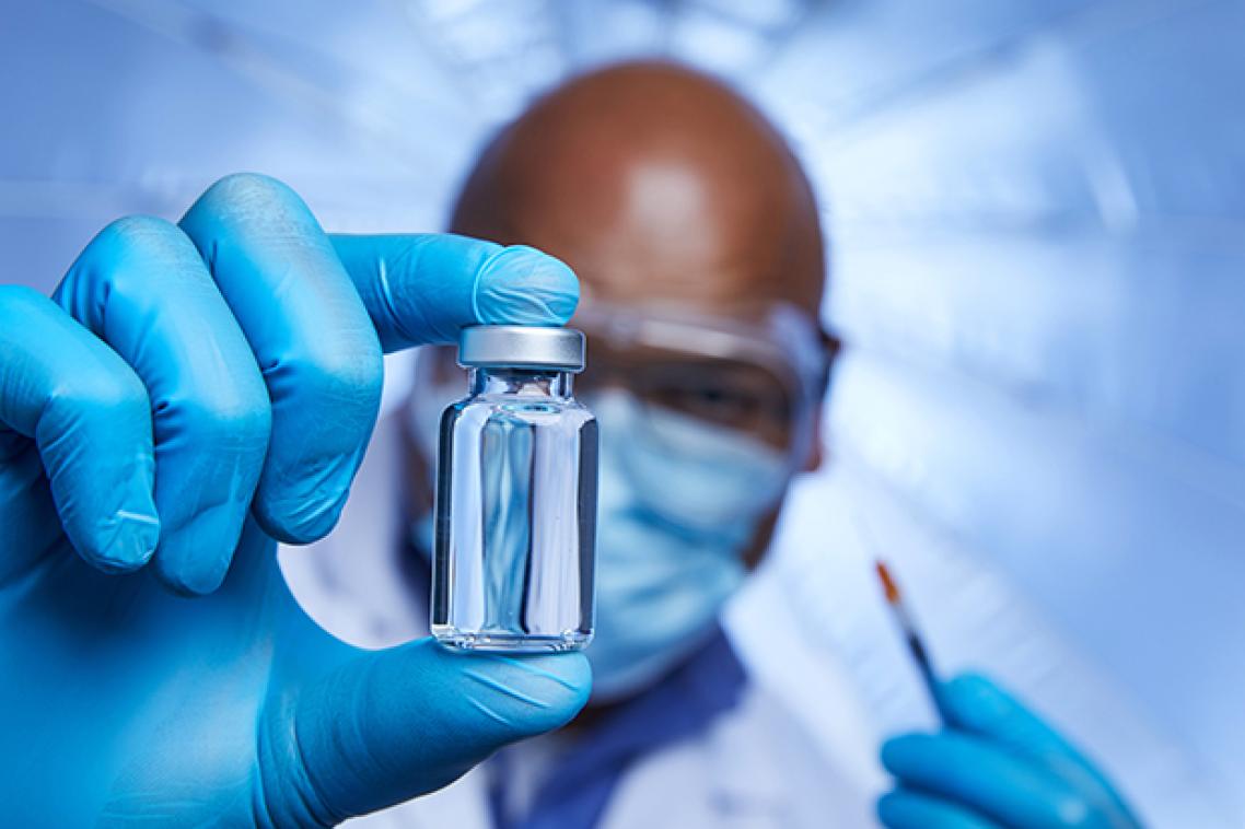 Man holding a vial