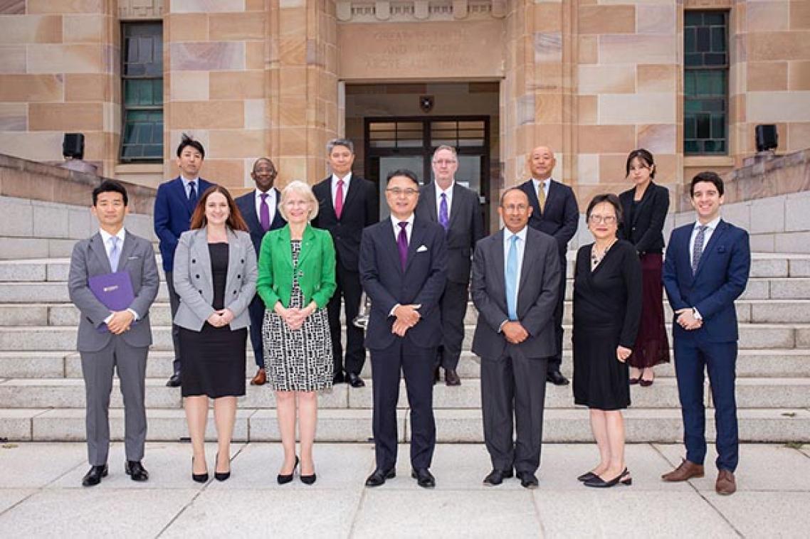 Participants in the signing ceremony on the steps of UQ's Forgan Smith building