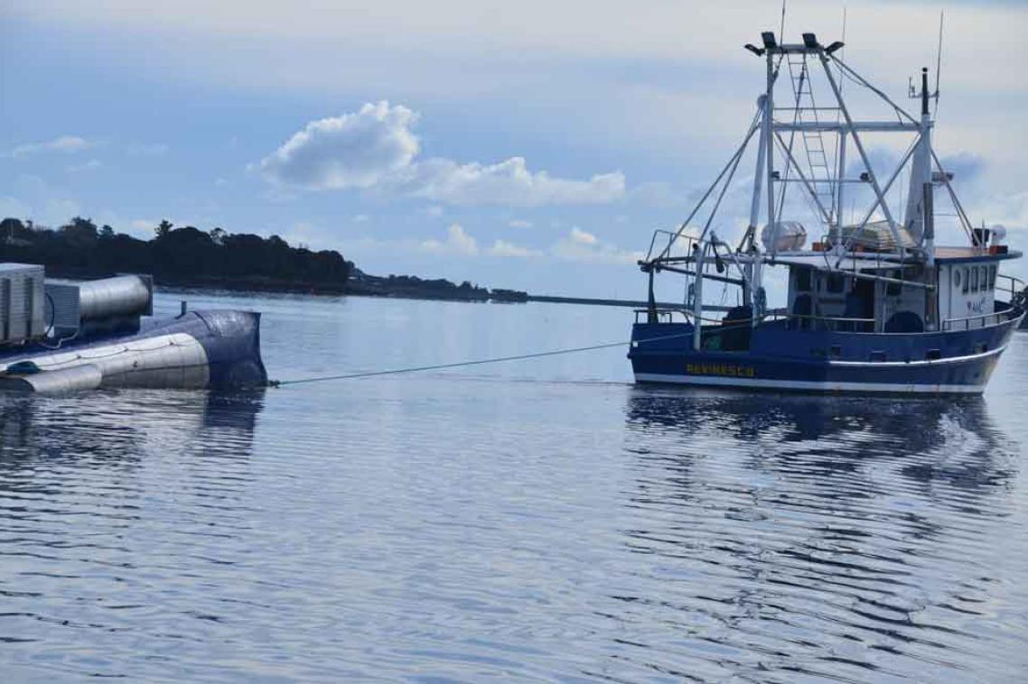 A tidal energy turbine being towed out to a site in the Tamar
