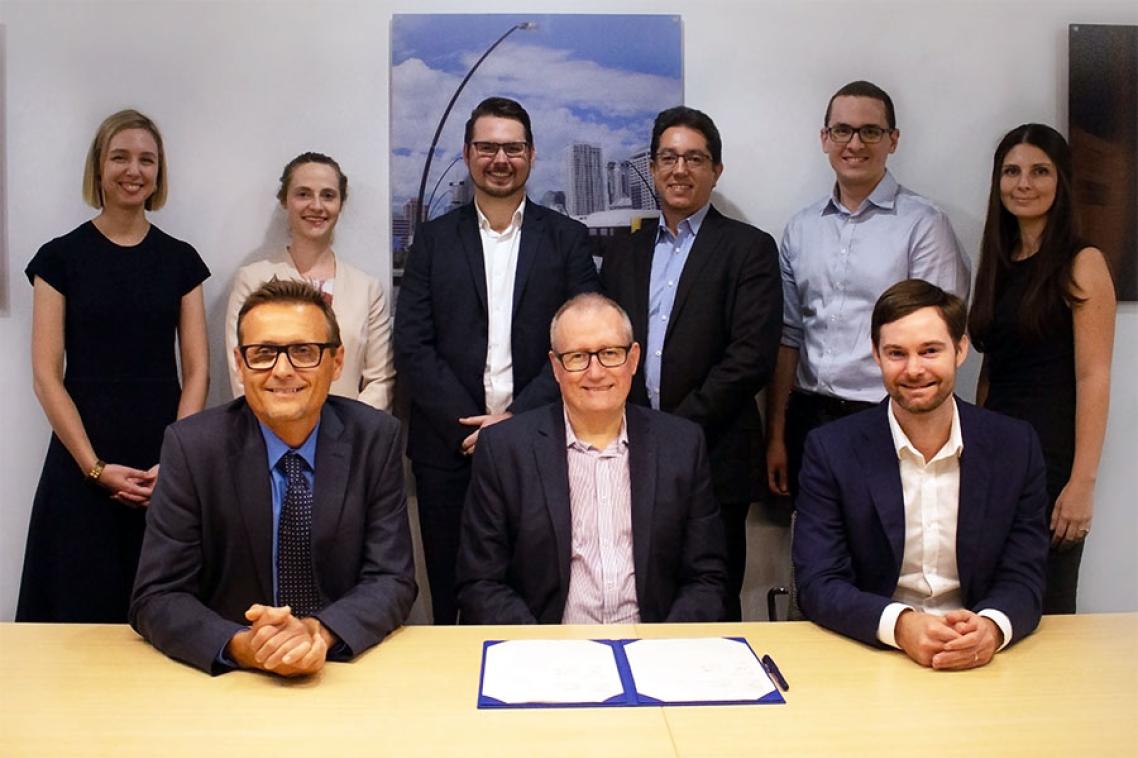 Front row: UQ School of Civil Engineering head Professor Simon Washington, UQ Director of Research Partnerships Joe McLean, VLC CEO Tim Veitch. UQ's Dr Jake Whitehead (back row, third from left)