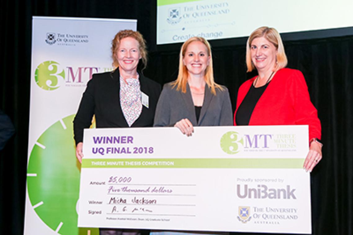 winner-micha-jackson-holding-a-big-dummy-cheque-flanked-by-competition-officials
