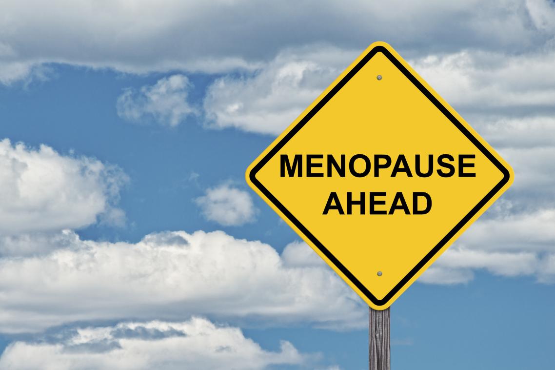 A road sign reads 'Menopause ahead'