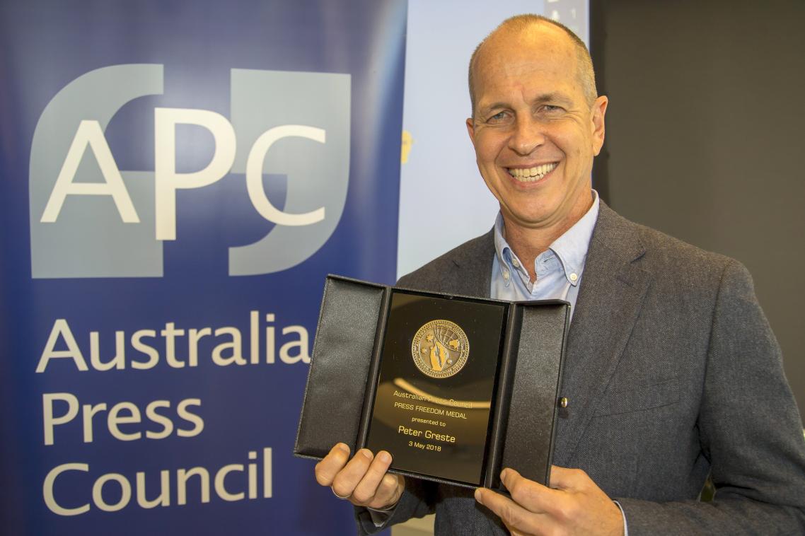 Peter Greste with his award