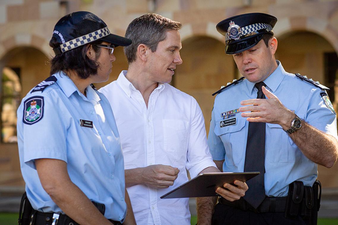 UQ’s Dr Jason Tangen (centre) with Sergeant Kristine Nedwich and Acting Inspector Duncan McCarthy of the Queensland Police Service Forensic Services Branch