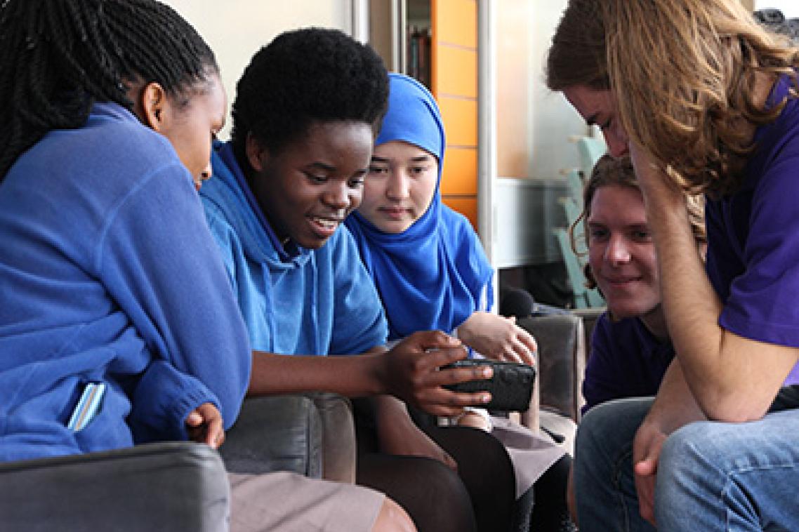 UQ journalism student with Woodridge State High School students. Photo by Daniel Seed