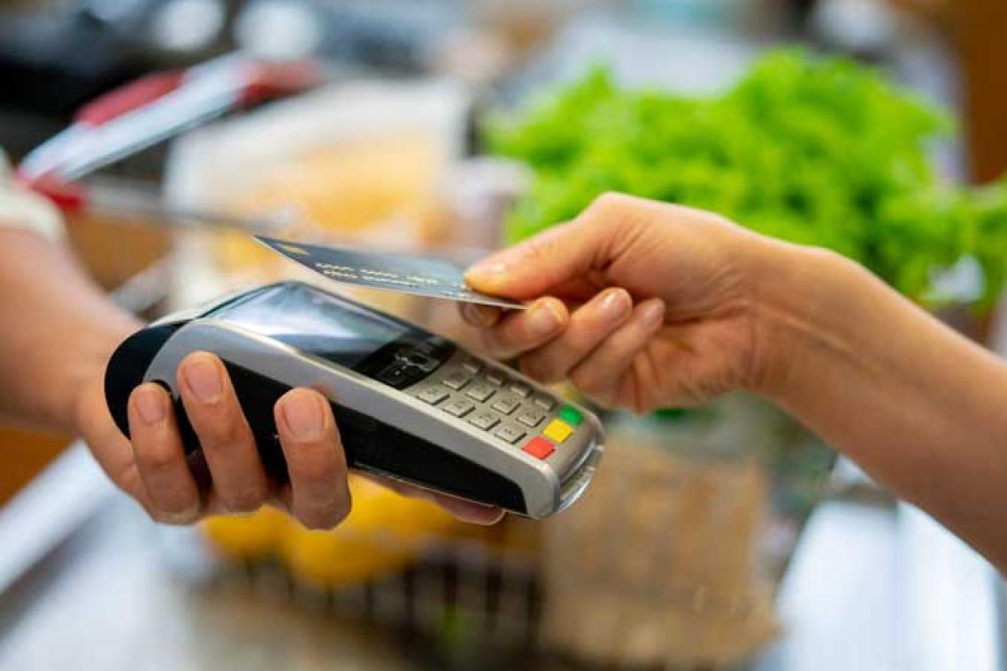 A card is scanned at a checkout. Stock image