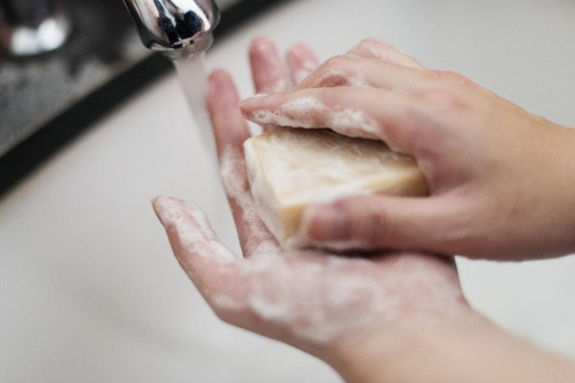 Hands washing with soap.