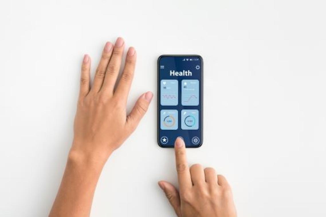 Hands with a smart phone showing health apps.