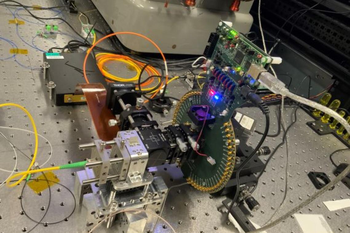 A machine the size of a shoebox with wiring and software, sitting in a laboratory.